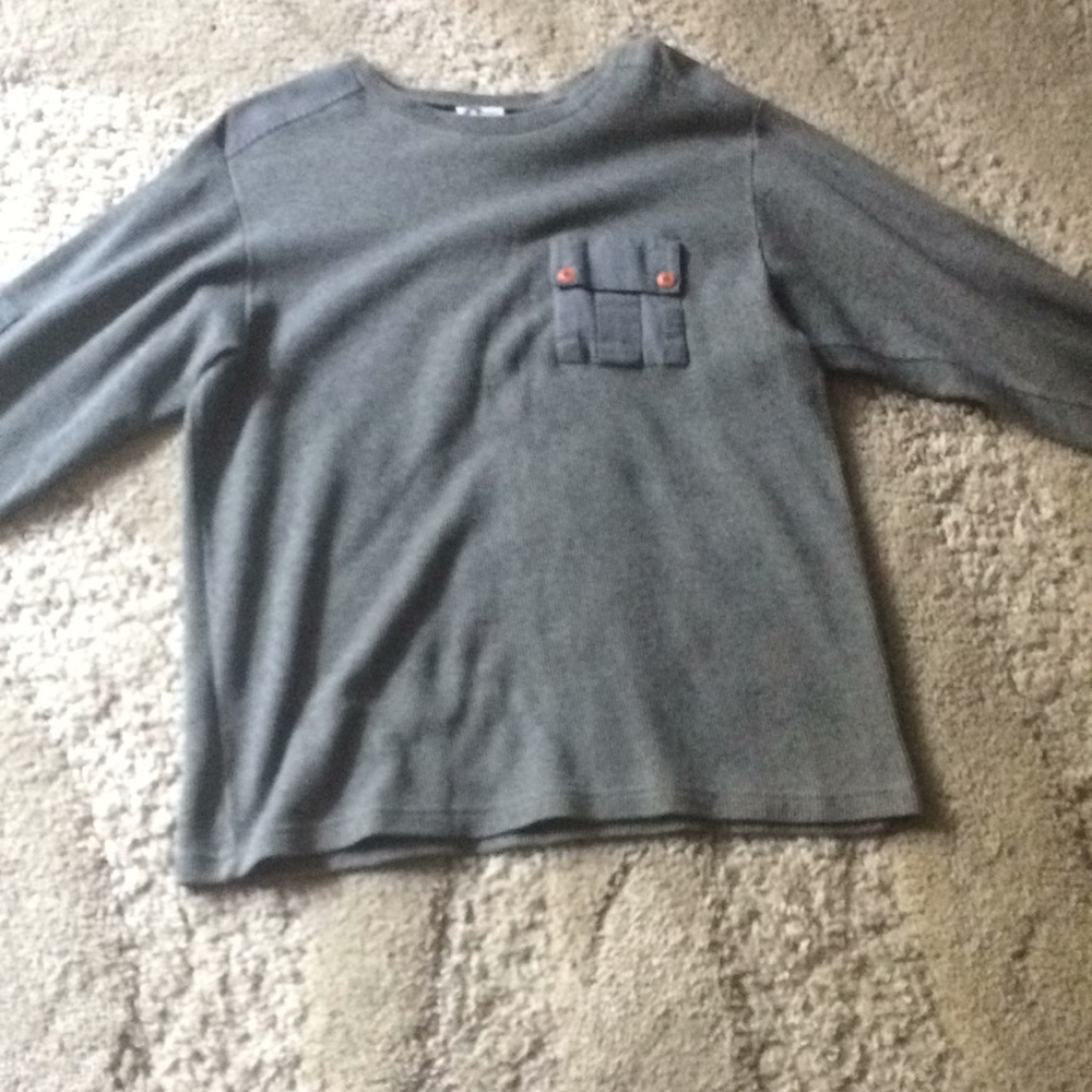 A grey sweater the material is heavy